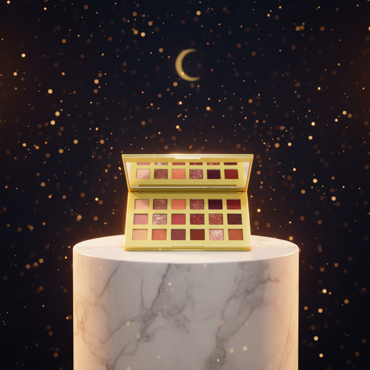 Luna Luxe 18-Shade Eyeshadow Palette - improved hero shot on marble pedestal with all 18 earth tone pans blazing in warm amber and gold light against midnight navy backdrop